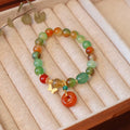 Natural peacock green agate bracelet with 8mm beads and butterfly peace buckle on white background