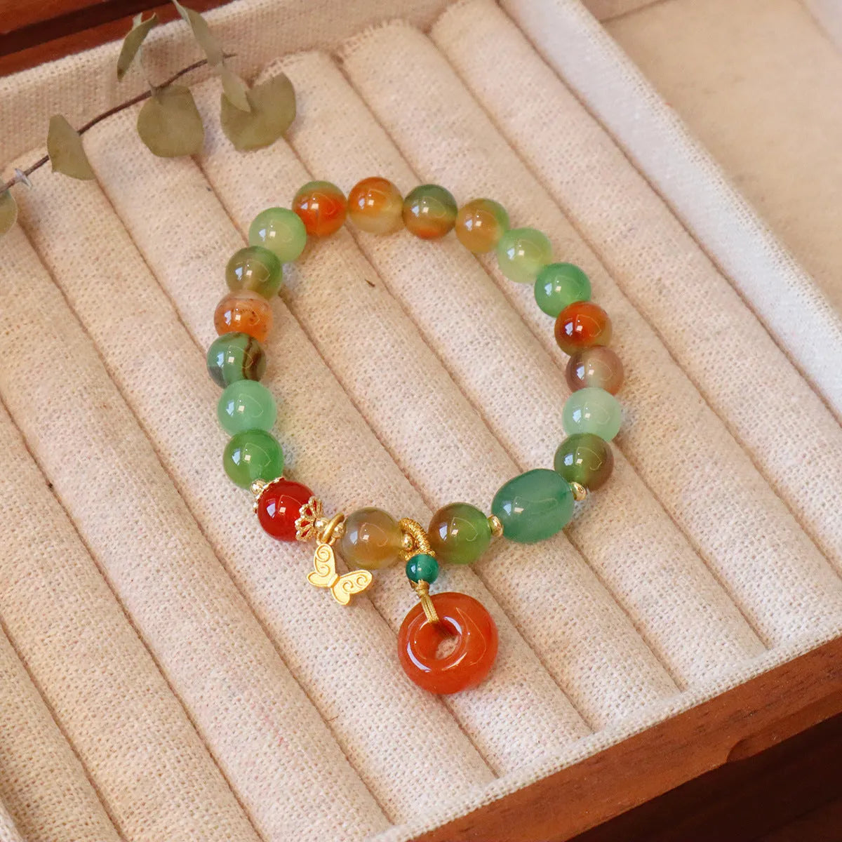 Natural peacock green agate bracelet with 8mm beads and butterfly peace buckle on white background