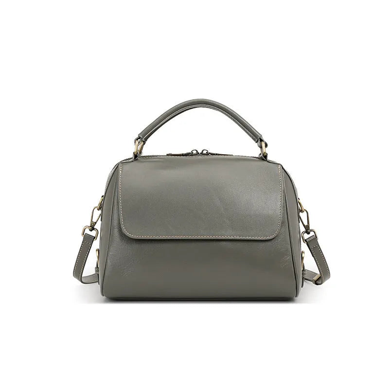 Women's soft genuine leather crossbody tote bag in a square shape with a double strap, shown in apricot colour.