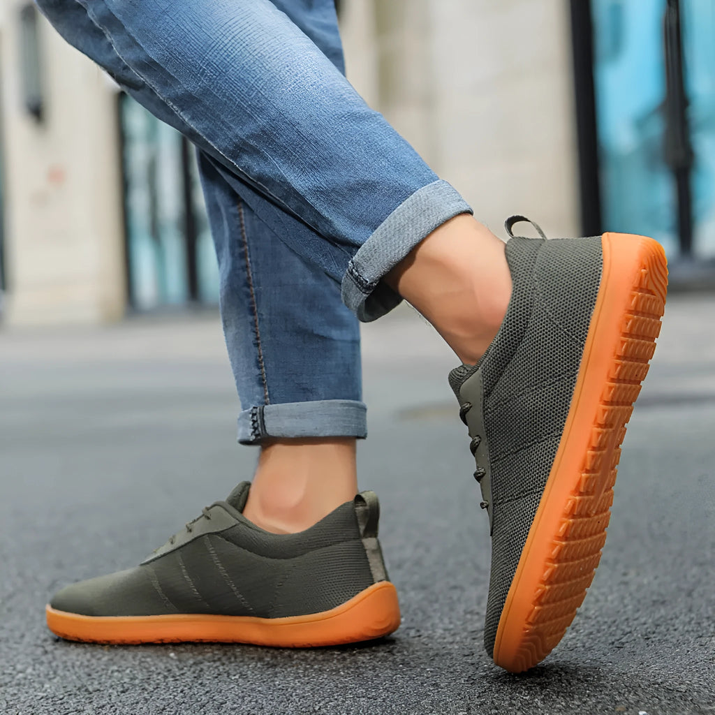 Men's low top walking shoes in Flyknit with non-slip rubber sole, shown in black colour with lace-up front.