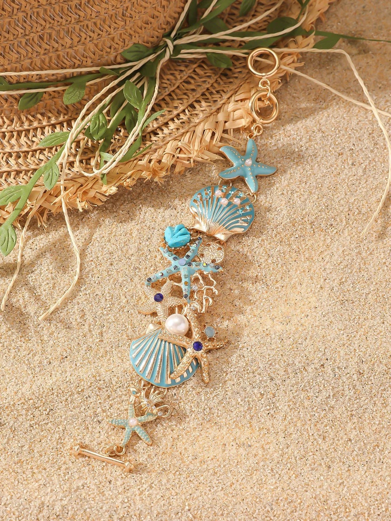 Alloy rhinestone starfish bracelet with boat anchor charm in blue, red, or turquoise.
