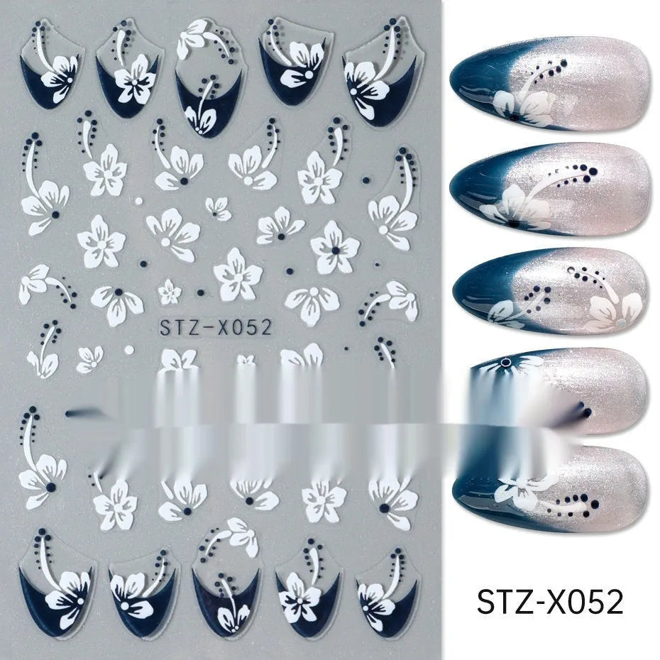 Sheet of black and silver love heart pattern nail art stickers with a plastic nail patch.