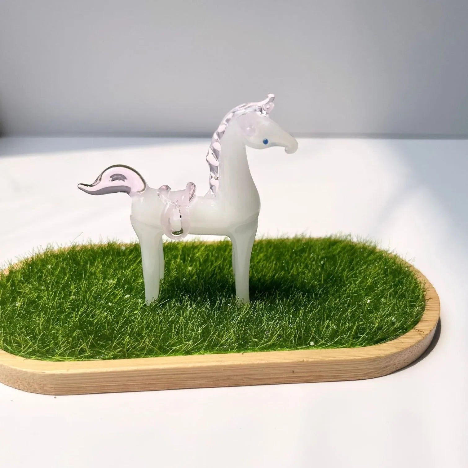 Coloured glaze horse sculpture in brown finish on wooden desk