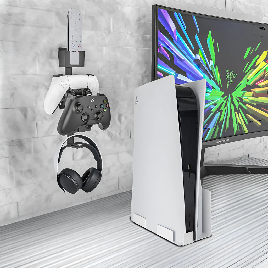 White ABS plastic wall-mounted hook holding a PlayStation game controller and headphones.
