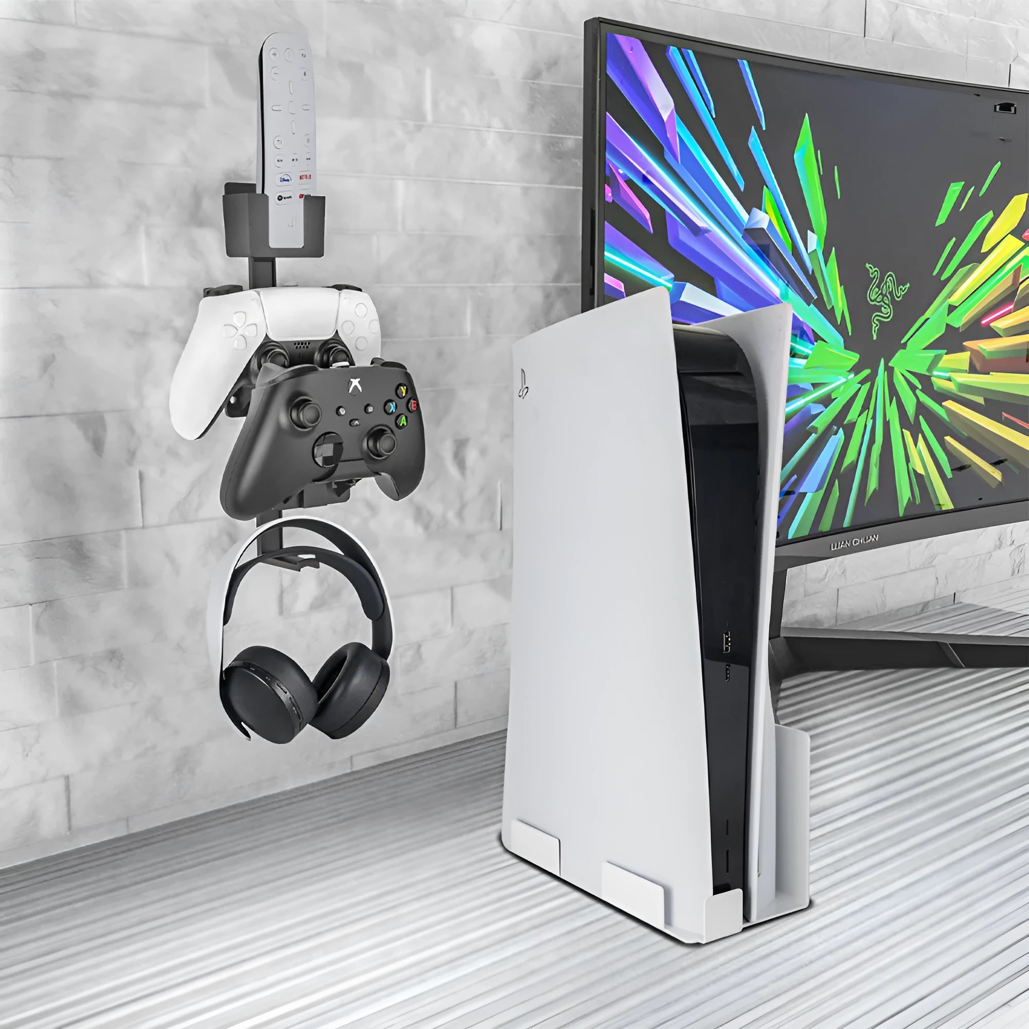 White ABS plastic wall-mounted hook holding a PlayStation game controller and headphones.