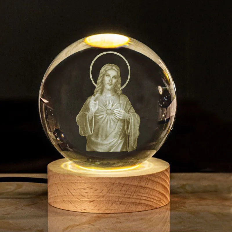 White crystal ball with cross and religious symbols on wooden LED base desk ornament