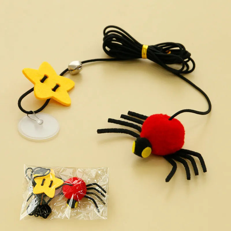 Cat hanging door toy with elastic rope, feather, bell and spider attachment in red colour
