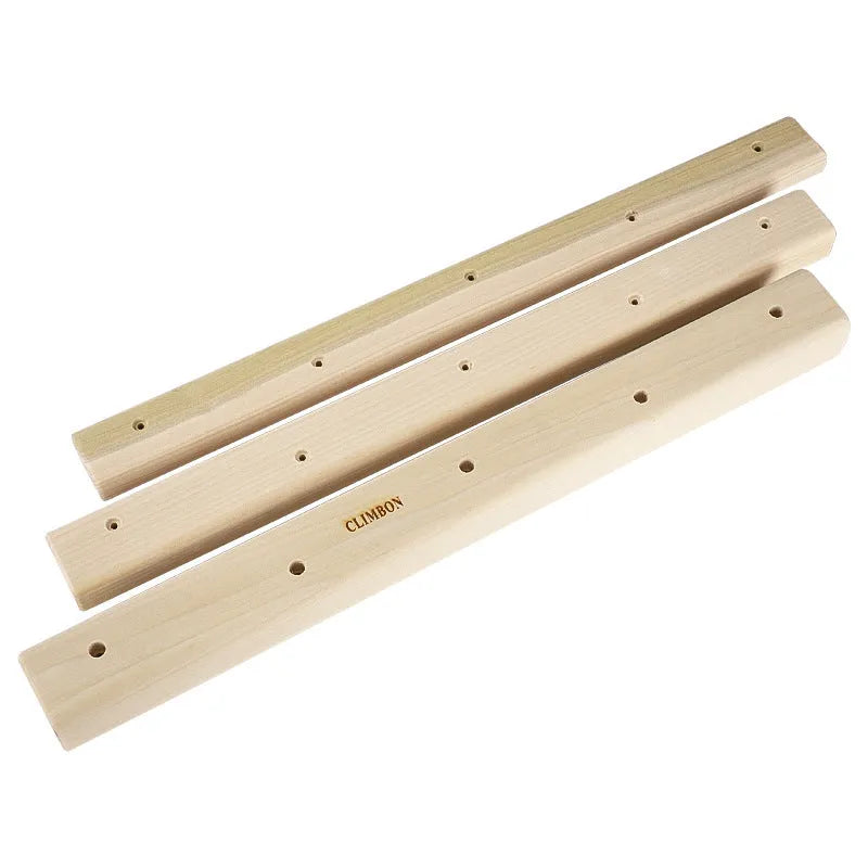 Set of three solid wood grip strength training hangboards in varying thicknesses.