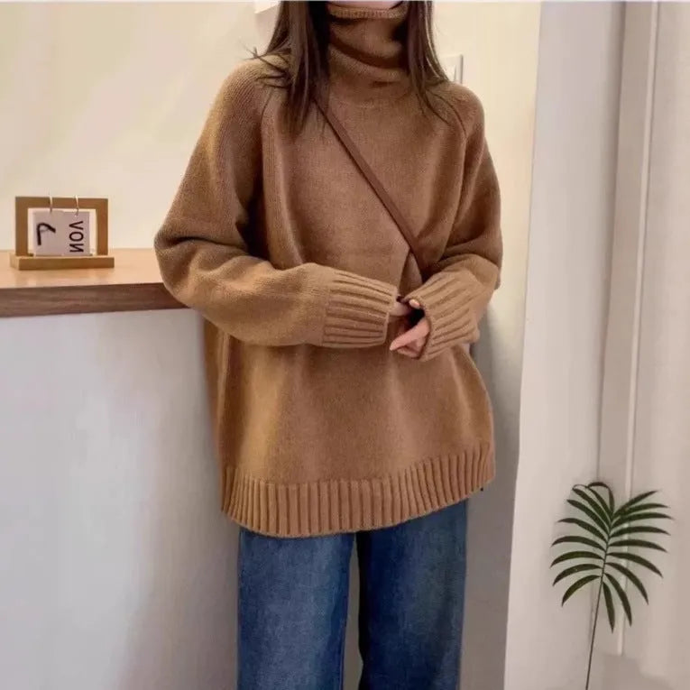 Red women's loose turtleneck sweater with a thick, textured curling pile collar.