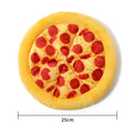 Yellow pizza slice shaped squeaky dog chewing toy with textured toppings and crust detailing