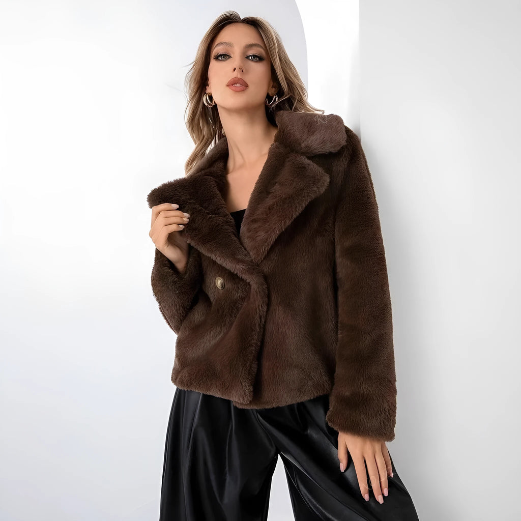 Women's short loose artificial fur coat in rose red colour with regular sleeves.