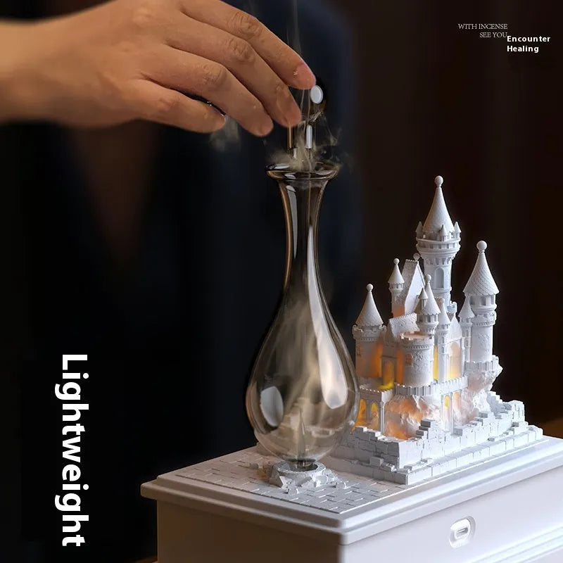 White medieval castle aromatherapy machine with ambient light and USB charging cable