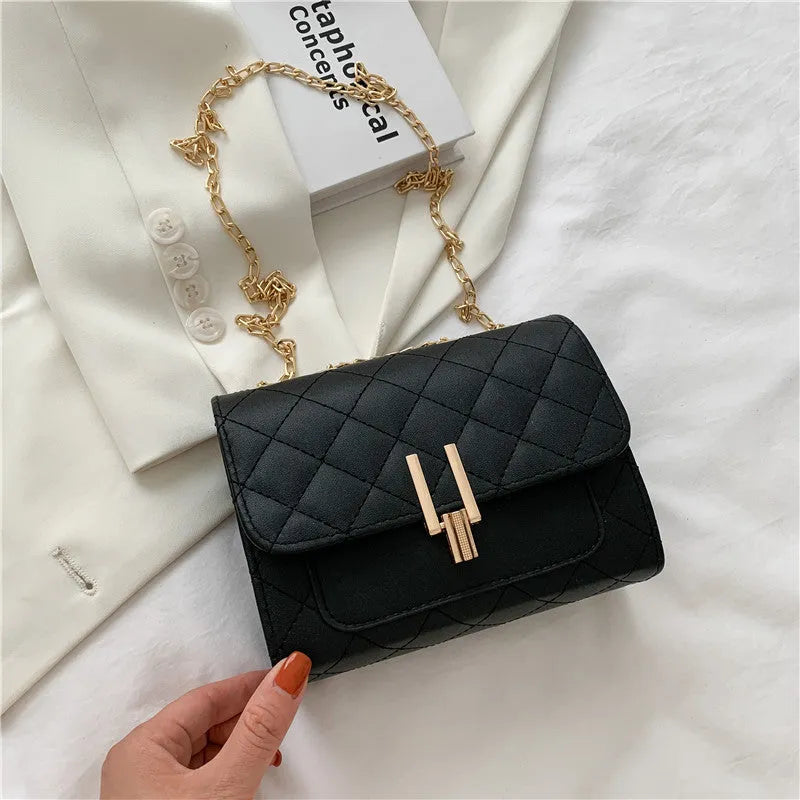Women's black PU crossbody bag with a diamond lattice chain design on the front