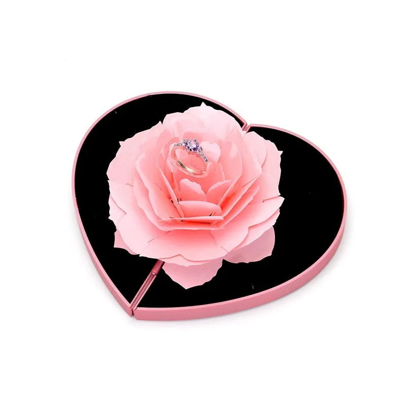 3D Love Box heart-shaped rotating rose flower ring box in red plastic on white background