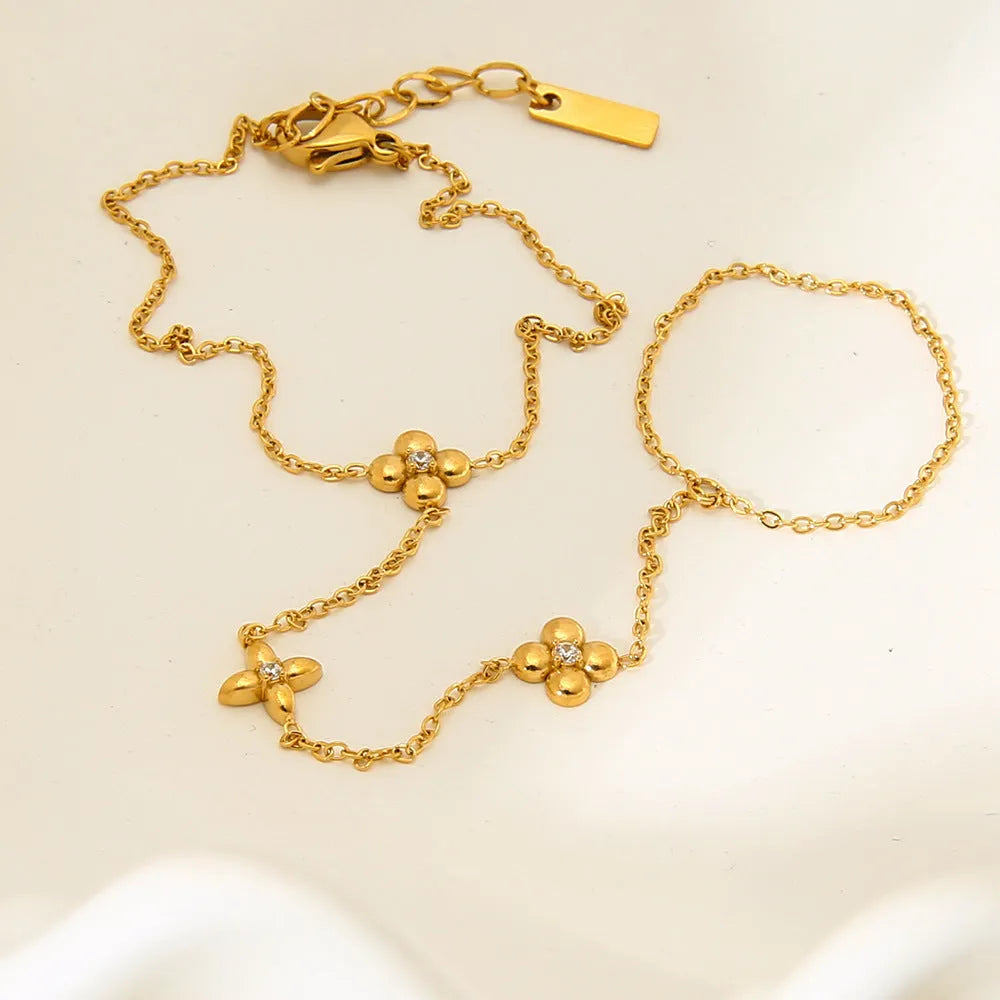 Gold stainless steel bracelet with eight-pointed stars and floral geometric design for women