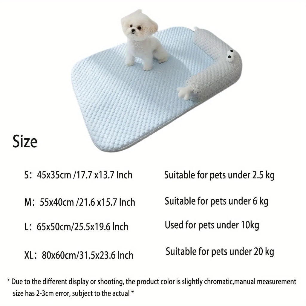 Blue pet bed cushion with a big-eyed monster design on a wooden floor.