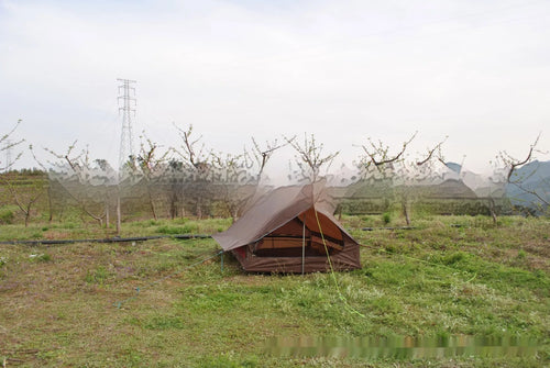 Brown or white A-line cabin tent using hiking canes for support with dimensions 210x150x110cm
