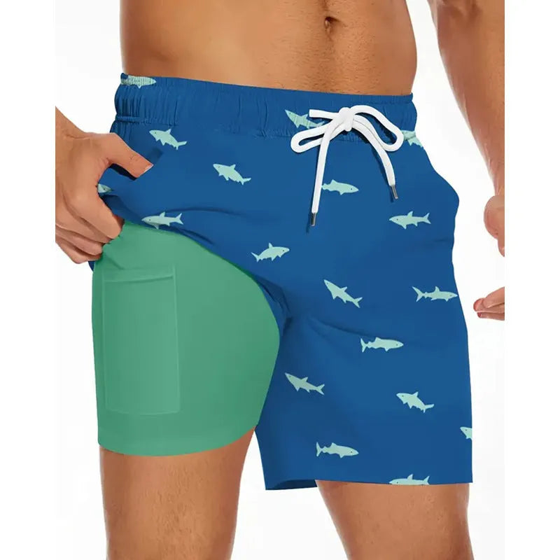 Man wearing loose light blue polyester beach pants on sand, showing plus size fit.
