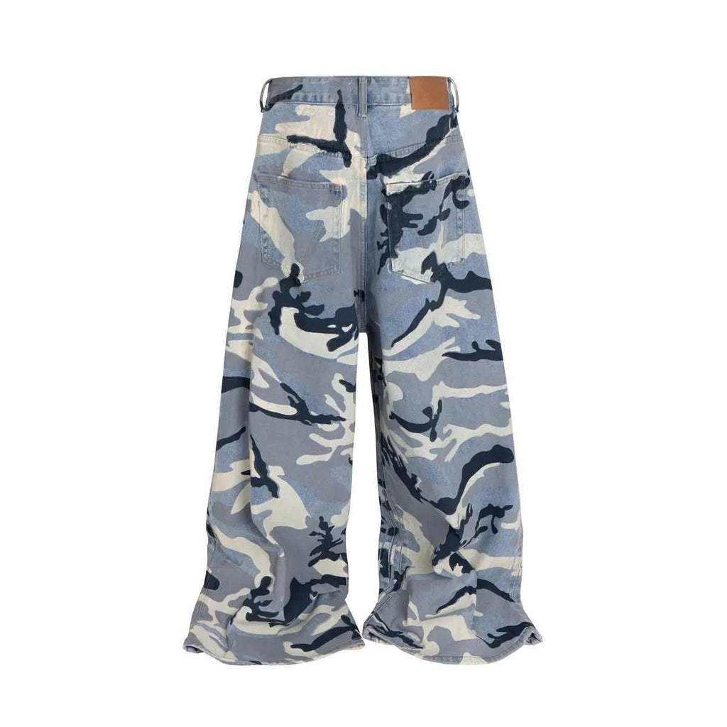 Snow camouflage pattern on blue loose-fit denim jeans with a mid waist.