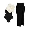 Close-up of a solid colour one-piece swimsuit with raised three-dimensional flower pattern detail
