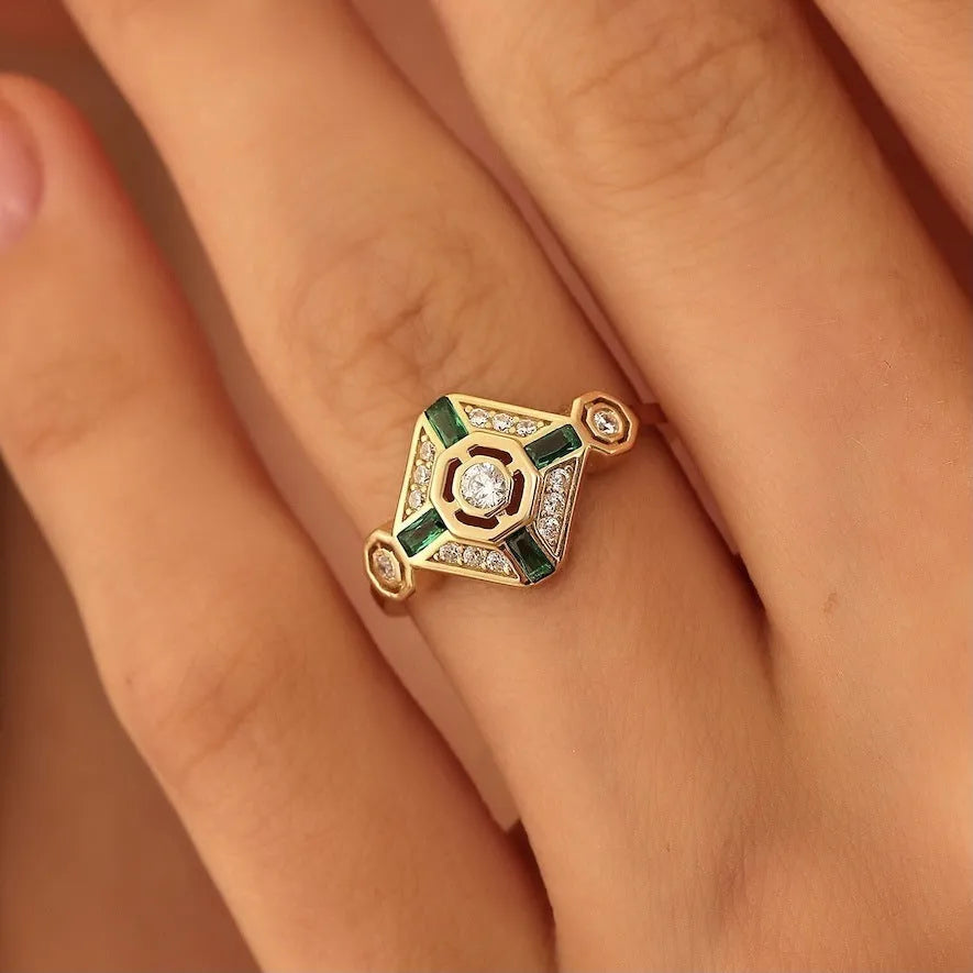 Square geometric ins style women's ring in lvzuan colour on a plain background.