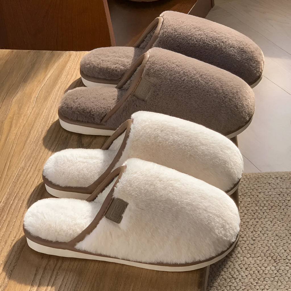 Solid colour PVC winter plush house slippers with car stitching detail on a non-slip sole.
