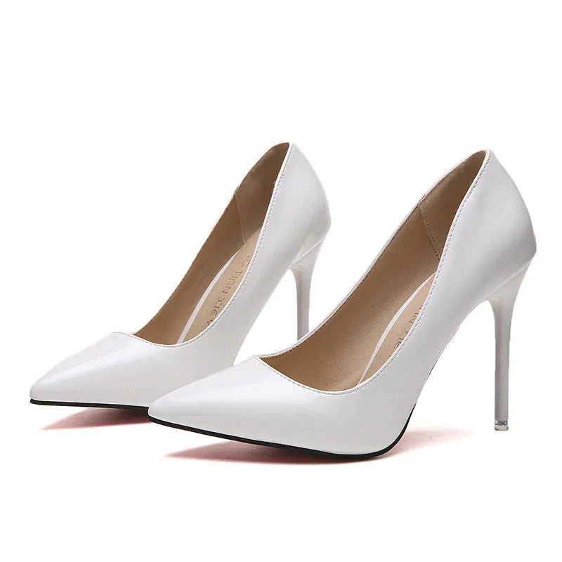 Women's stiletto heel pumps in apricot colour with pointed toe and buckle detail