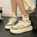 Women's green casual shoes with a round toe and flat heel, made from breathable PU mesh.