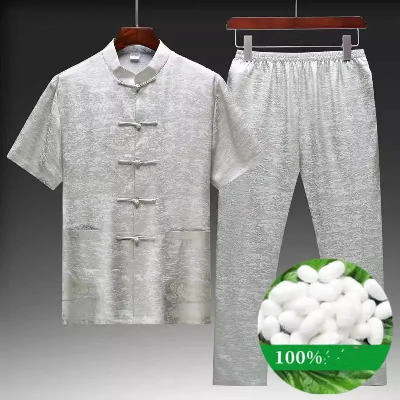Men's light green mulberry silk Tang suit jacket and trousers set on a hanger.