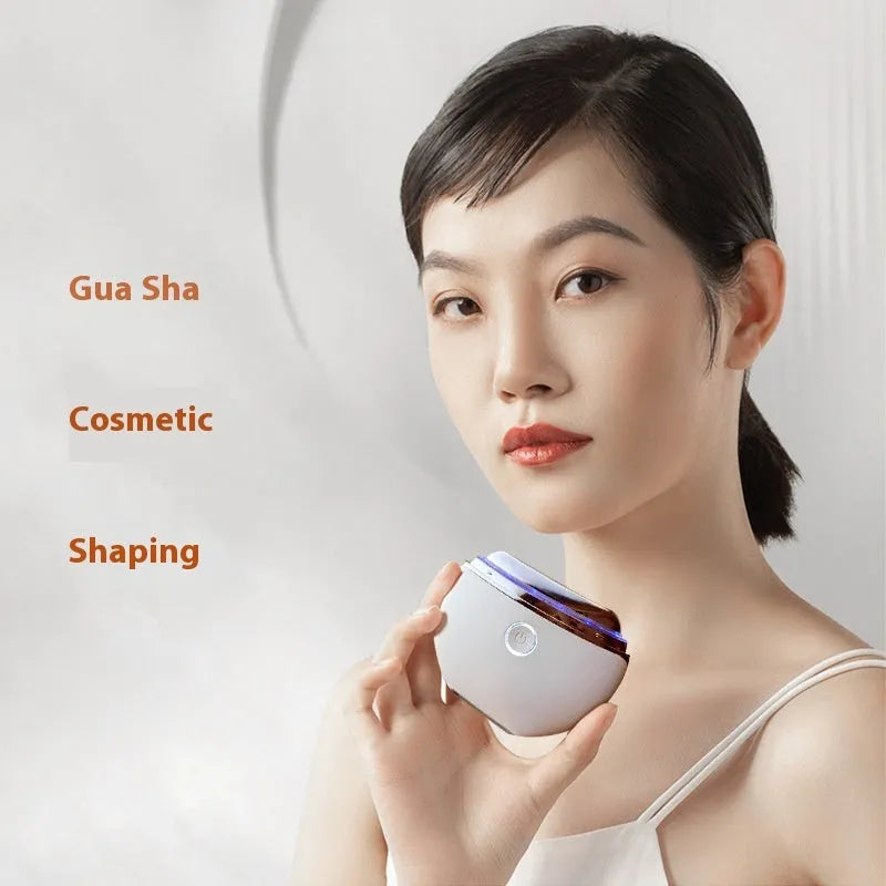 French pattern handheld electric beauty device for scraping and IPL light therapy.