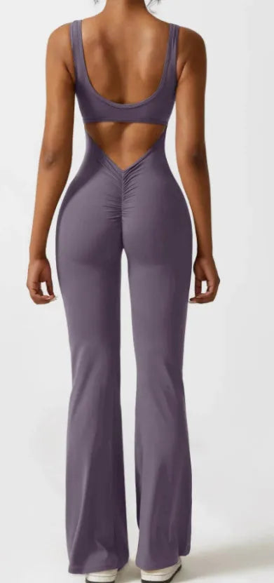 Women's black milk silk yoga bodysuit with seamless design and mid waist.