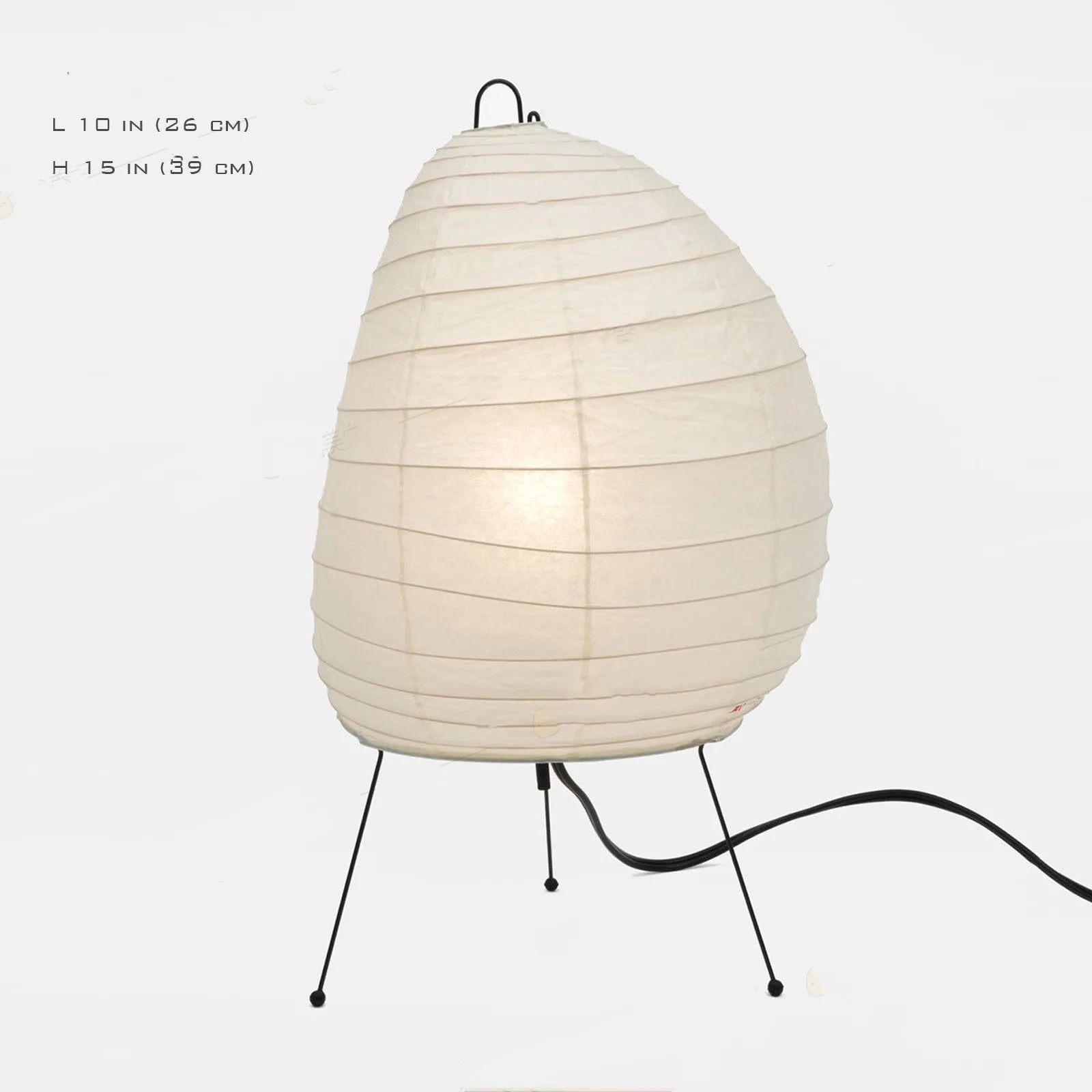 Japanese style rice paper table lamp with aluminium body and decorative shade on wooden surface