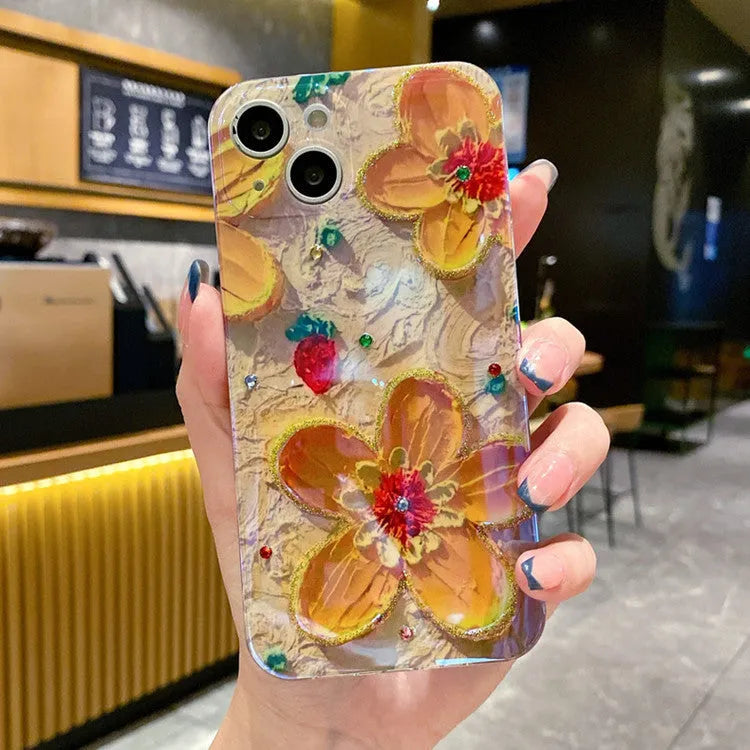 Purple and yellow mobile phone cases with oil painting floral design and inlaid diamond decoration.
