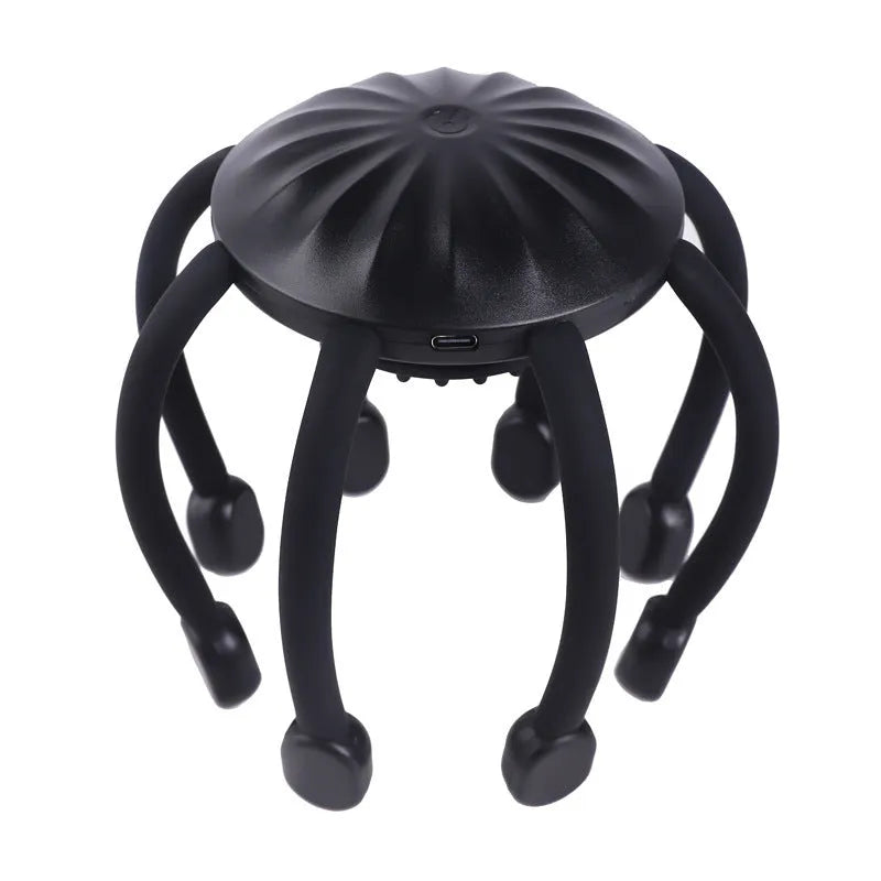 Black USB-powered head massager with multiple claws placed on a scalp