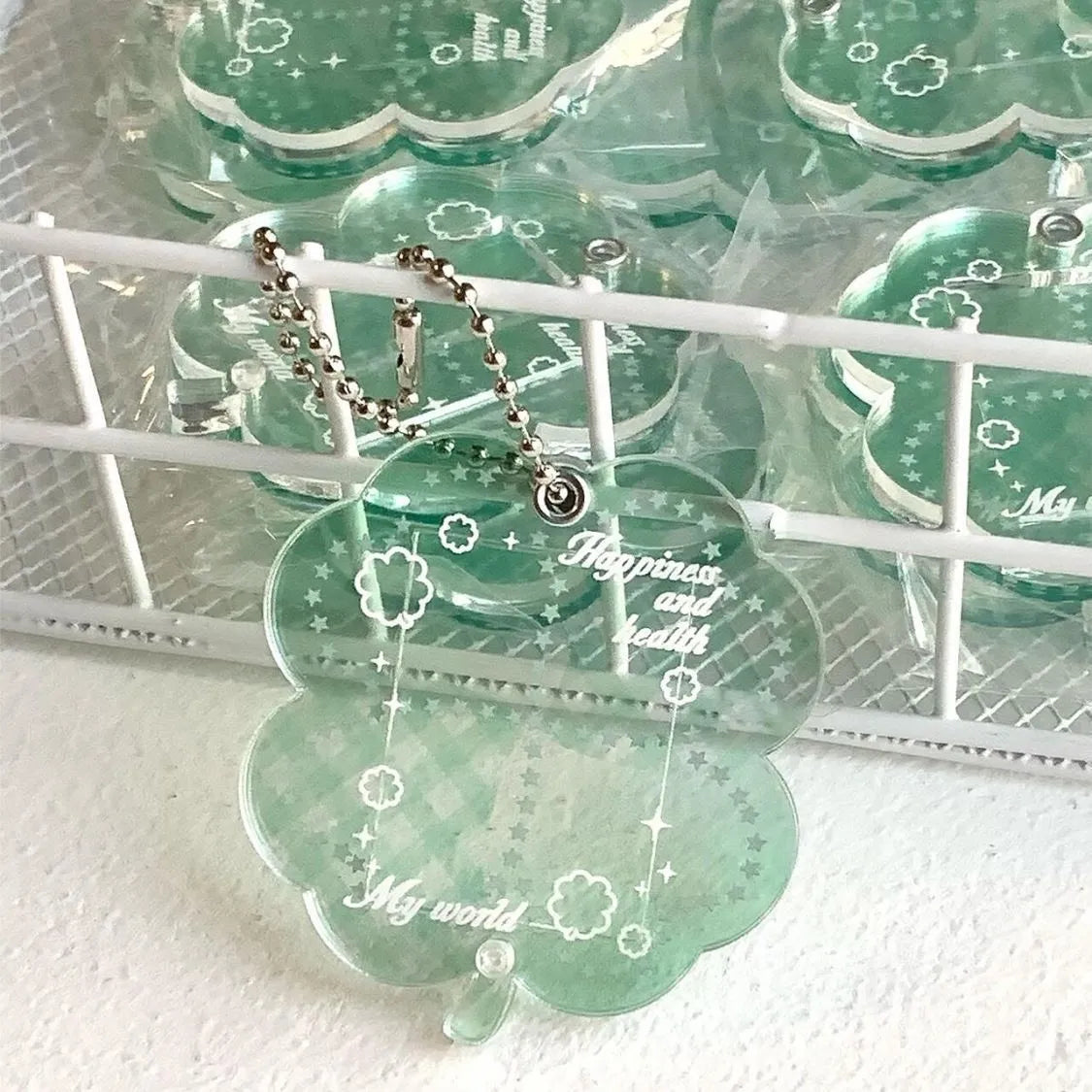 Acrylic four-leaf clover pendant keychain in elegant blue, grass green, or mint green.