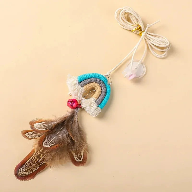 Colourful feather cat rope toy hanging from a door with elastic swing and sticky buckle clamp