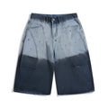 Blue tie-dye gradient cropped jeans with a worn-looking finish and loose, relaxed fit.