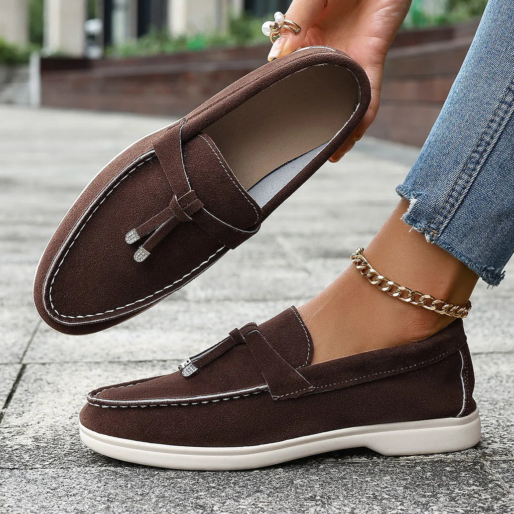 Casual canvas slip-on loafers with a platform heel and round toe in black, apricot, and brown colour options.