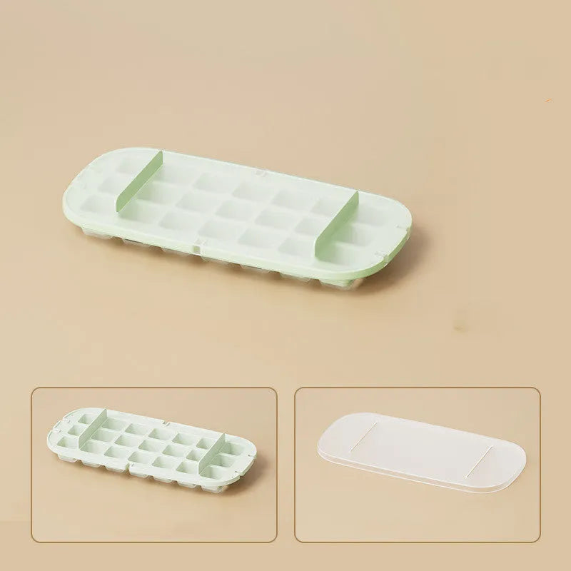 High-capacity ice cube tray in blue with leverage handle and integrated ice shovel storage compartment