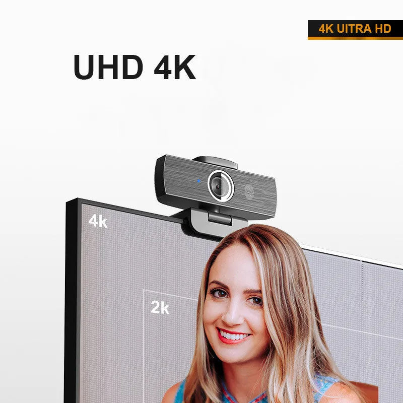 Black 8MP 4K USB computer webcam with magnetic privacy cover on a desktop