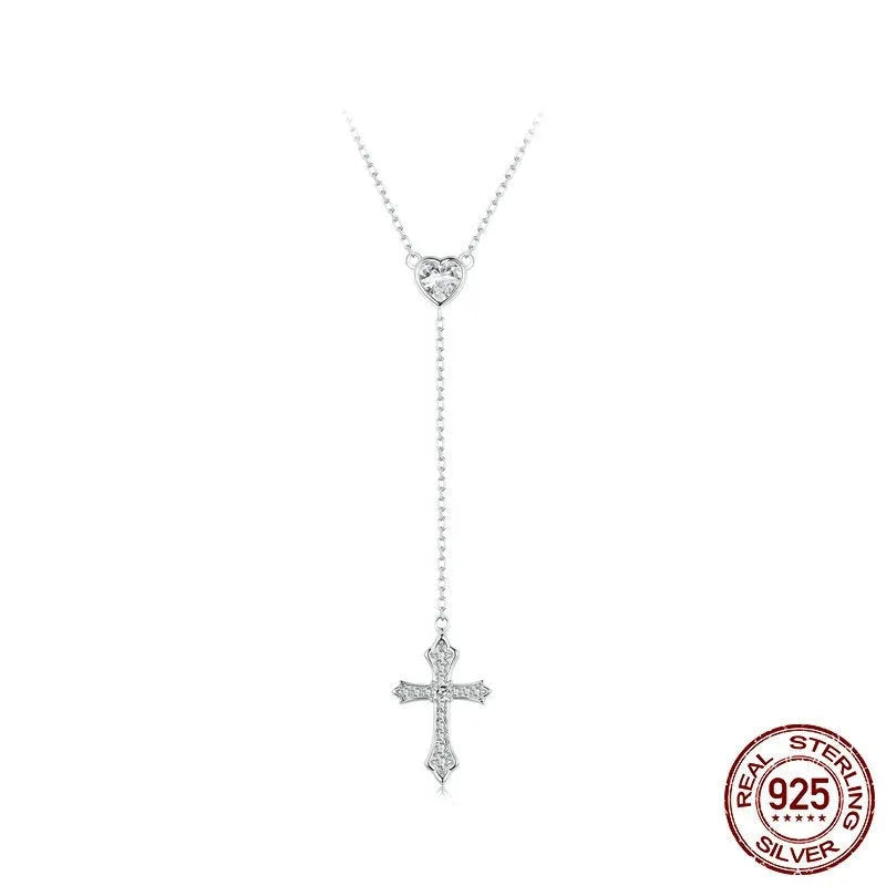 Simple sterling silver V-neck cross pendant on an O-ring chain necklace.