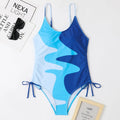 Women's sleeveless one-piece swimsuit in blue colour with backless design for swimming sports
