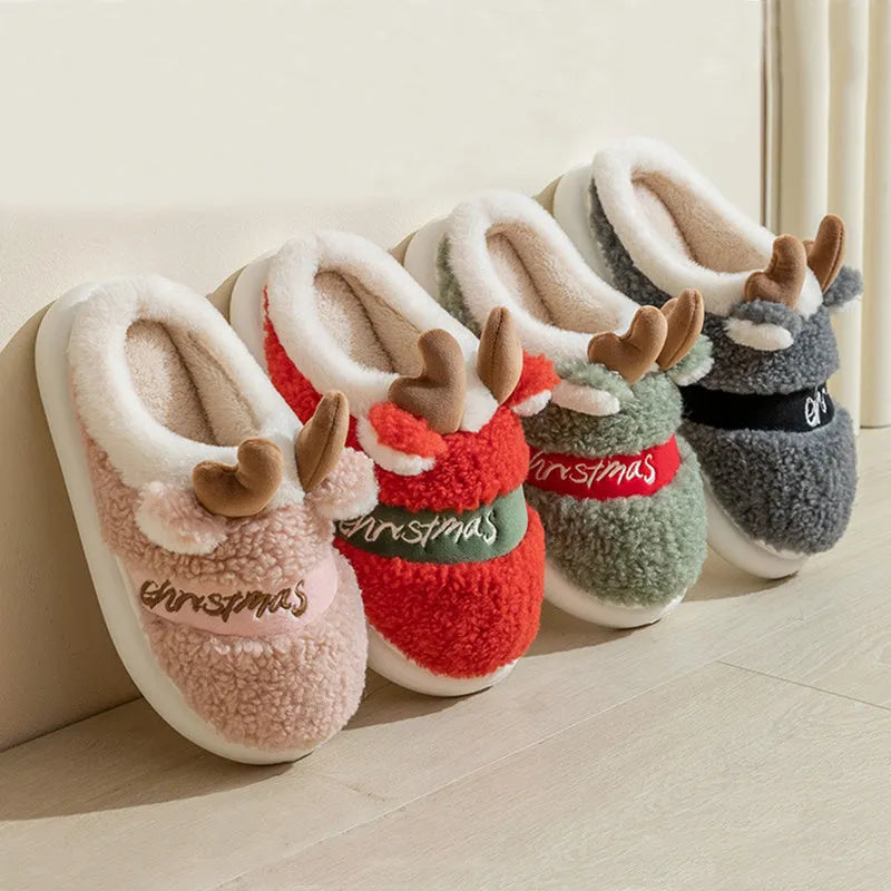 Pair of Christmas elk winter home slippers with suede upper, available in candy colours