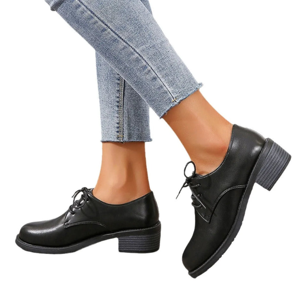 Black women's chunky heel ankle boots with rubber sole and professional styling