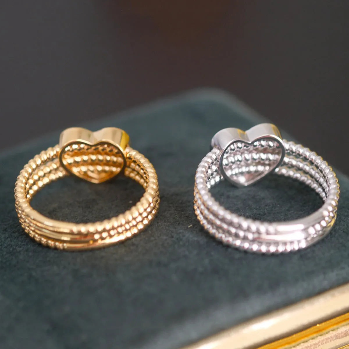 S925 sterling silver ring with heart twist design, available in white gold or yellow gold finish, US sizes 6 to 10