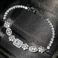 Women's geometric bracelet with silver and white gold plating and sparkling inlaid zircon stones.