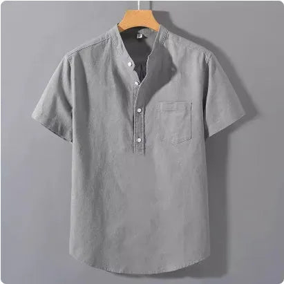 Men's beige loose-fit linen short sleeve shirt with a stand collar on a hanger.