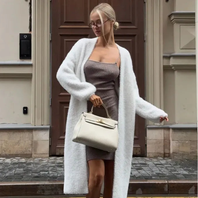 White longline knitted cardigan jacket with regular sleeves on a model.