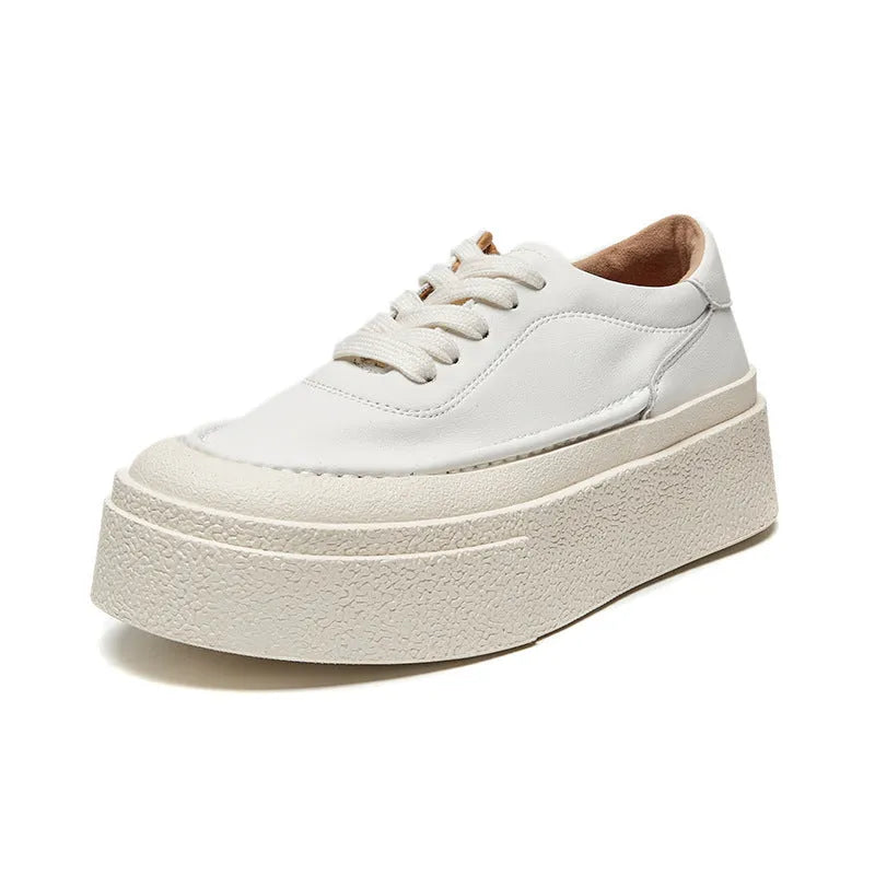 Women's black platform sports shoes with embossed cowhide upper and rubber sole, tied design detail