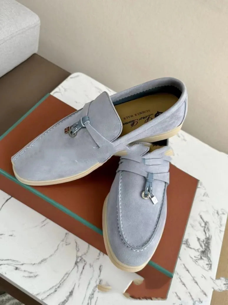Unisex high-top slip-on loafers with a round toe cap and rubber sole on a neutral background.